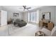 Serene main bedroom with natural light, neutral tones, and a ceiling fan at 13 Ivy Ne Sq, Atlanta, GA 30342