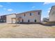 Expansive backyard featuring a covered patio, ample space, and a young tree at 2781 Dolce Rd, Dacula, GA 30019
