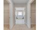 Ensuite bathroom with dual walk-in closets and a soaking tub at 2781 Dolce Rd, Dacula, GA 30019