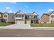 Beautiful two-story brick home with a three car garage and well-manicured front lawn at 2781 Dolce Rd, Dacula, GA 30019