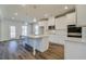Modern kitchen featuring white cabinets, quartz countertops, stainless steel appliances, and a spacious island at 2781 Dolce Rd, Dacula, GA 30019