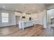 Contemporary kitchen with white cabinets, a center island, and stainless steel appliances in a bright, open space at 2781 Dolce Rd, Dacula, GA 30019