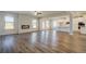 Expansive open living area with modern fireplace and connection to the bright kitchen at 2781 Dolce Rd, Dacula, GA 30019