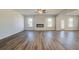 Open-concept living area with fireplace, ceiling fan and tons of natural light at 2781 Dolce Rd, Dacula, GA 30019