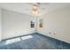 This simple bedroom features blue carpet, white walls, and a ceiling fan at 321 Covered Bridge Sw Pl, Smyrna, GA 30082