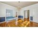 This dining room features hardwood floors, elegant lighting, and stylish two-tone wall decor at 321 Covered Bridge Sw Pl, Smyrna, GA 30082