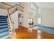 Open foyer showcasing hardwood floors, staircase, and an open layout at 321 Covered Bridge Sw Pl, Smyrna, GA 30082