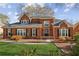 Beautiful two-story brick home with manicured lawn, mature shrubs, and a classic design at 321 Covered Bridge Sw Pl, Smyrna, GA 30082