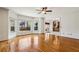 Bright and airy living room features hardwood floors, large windows, and neutral paint at 321 Covered Bridge Sw Pl, Smyrna, GA 30082
