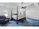 Spacious main bedroom features a four-poster bed, tray ceiling and windows for natural light at 321 Covered Bridge Sw Pl, Smyrna, GA 30082