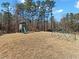 Large backyard with play equipment, featuring a slide and geometric climbing dome at 8470 Wallace Tatum Rd, Cumming, GA 30028