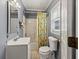 Cozy bathroom featuring a shower/tub combination and white vanity at 8470 Wallace Tatum Rd, Cumming, GA 30028