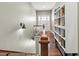 Bright hallway with wood floors leading to the front door and a bookshelf at 8470 Wallace Tatum Rd, Cumming, GA 30028