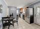 Inviting kitchen with stainless steel appliances and adjacent dining area at 8470 Wallace Tatum Rd, Cumming, GA 30028