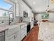 Stylish kitchen with white cabinets, subway tile backsplash, and farmhouse sink at 8470 Wallace Tatum Rd, Cumming, GA 30028