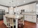 Beautiful kitchen with white cabinetry, granite counters, and stainless appliances at 8470 Wallace Tatum Rd, Cumming, GA 30028