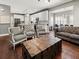 Open-concept living room with modern furniture and seamless flow to the kitchen at 8470 Wallace Tatum Rd, Cumming, GA 30028