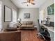 Comfortable office space with hardwood floors and a cozy seating area at 8470 Wallace Tatum Rd, Cumming, GA 30028