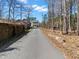 A charming home features two-story with a long driveway, landscaping, and proximity to amenities at 8470 Wallace Tatum Rd, Cumming, GA 30028