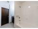 This bathroom features a white tub with tile surround at 1221 Caroline Ne St # 201, Atlanta, GA 30307