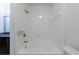 This bathroom features a white tub with tile surround at 1221 Caroline Ne St # 201, Atlanta, GA 30307