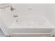 This bathroom features a white soaking tub at 1221 Caroline Ne St # 201, Atlanta, GA 30307