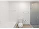 This bathroom features a shower and tub with white tile surround at 1221 Caroline Ne St # 201, Atlanta, GA 30307