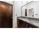 Bathroom features a granite countertop, modern fixtures, and ample storage space at 1221 Caroline Ne St # 201, Atlanta, GA 30307