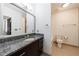 Bathroom features a granite countertop, modern fixtures, and ample storage space at 1221 Caroline Ne St # 201, Atlanta, GA 30307