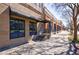 Street-side view of a brick commercial building with awnings and well-maintained sidewalks at 1221 Caroline Ne St # 201, Atlanta, GA 30307