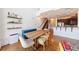 Open concept dining room featuring hardwood floors, stylish decor and adjacent kitchen with bar seating at 1221 Caroline Ne St # 201, Atlanta, GA 30307