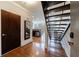 Inviting entryway showcases hardwood floors, a modern staircase, and access to the kitchen at 1221 Caroline Ne St # 201, Atlanta, GA 30307