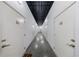 Storage unit hallway with numbered doors and overhead lighting at 1221 Caroline Ne St # 201, Atlanta, GA 30307