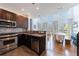 Modern kitchen with stainless steel appliances, mosaic backsplash, and open layout to living area at 1221 Caroline Ne St # 201, Atlanta, GA 30307