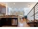 Well-lit kitchen with stainless steel appliances, granite countertops, dark cabinets, and an open floor plan at 1221 Caroline Ne St # 201, Atlanta, GA 30307