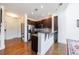 Open concept kitchen features granite countertops, stainless appliances, and convenient access to dining at 1221 Caroline Ne St # 201, Atlanta, GA 30307