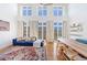 Inviting living room with large windows, hardwood floors, a comfortable sofa, and stylish decor at 1221 Caroline Ne St # 201, Atlanta, GA 30307