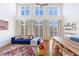 Inviting living room with large windows, hardwood floors, a comfortable sofa, and stylish decor at 1221 Caroline Ne St # 201, Atlanta, GA 30307