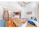 Bright living room featuring high ceilings, hardwood floors, modern staircase, and a comfortable blue sofa at 1221 Caroline Ne St # 201, Atlanta, GA 30307