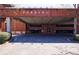 Entrance to covered parking garage with brick facade and prominent parking signage at 1221 Caroline Ne St # 201, Atlanta, GA 30307
