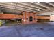 Multi-level parking garage, painted ceiling and brick entrance, providing parking and additional parking spaces at 1221 Caroline Ne St # 201, Atlanta, GA 30307