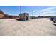 Open rooftop parking area with a small building and cars parked on a sunny day at 1221 Caroline Ne St # 201, Atlanta, GA 30307