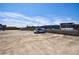 Wide view of an empty parking lot on a building rooftop under a bright blue sky at 1221 Caroline Ne St # 201, Atlanta, GA 30307