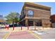 Multi-story retail building with brick facade, street-level storefronts and upper floor offices, ample parking at 1221 Caroline Ne St # 201, Atlanta, GA 30307