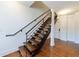 Modern staircase with wood treads and metal railing leads to the upper level at 1221 Caroline Ne St # 201, Atlanta, GA 30307
