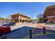 Exterior street view of commercial buildings with parking and landscaping at 1221 Caroline Ne St # 201, Atlanta, GA 30307