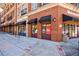 Brick retail building with black awnings over storefronts and well-marked sidewalk at 1221 Caroline Ne St # 201, Atlanta, GA 30307