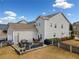 Spacious backyard featuring a patio area with outdoor seating and a grill, perfect for entertaining at 300 South Village Sq, Canton, GA 30115