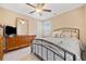 Comfortable bedroom with neutral decor, ceiling fan, and ample closet space at 300 South Village Sq, Canton, GA 30115