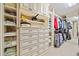 Walk-in closet with custom shelving and ample storage space for clothes and accessories at 300 South Village Sq, Canton, GA 30115